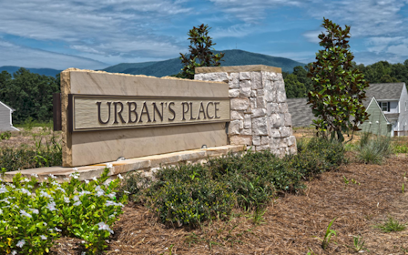 A house with a patio and a table and chairs.