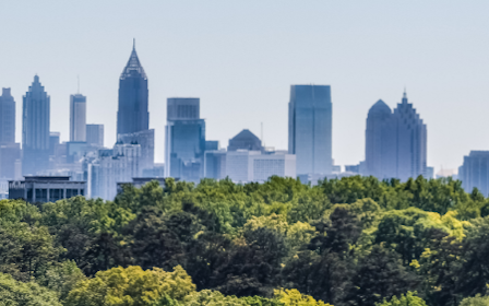 A city skyline with trees.