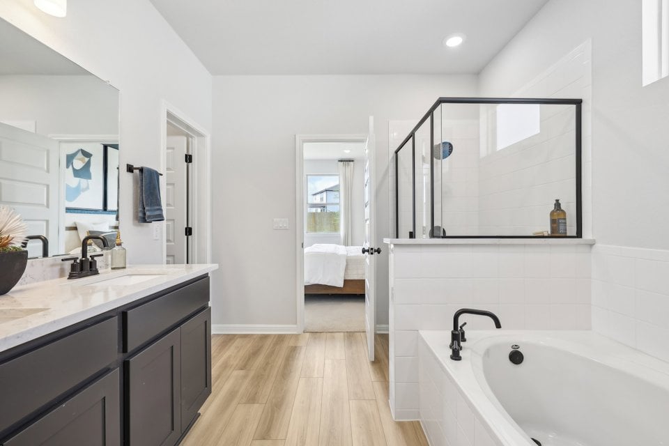 A bathroom with a tub and sink.