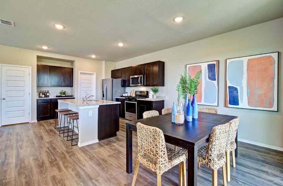 Santiago model dining room and kitchenfrom Blue Ridge Ranch in San Antonio by Century Communities
