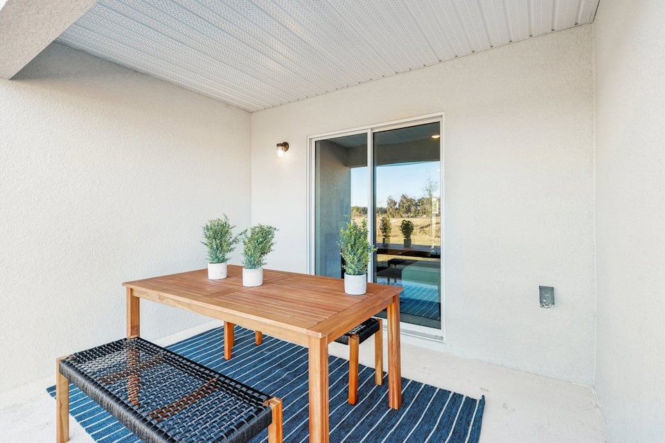 A table and chairs in a room.